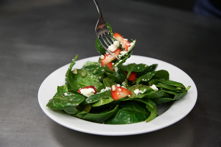 Spinach salad with strawberries andfFeta cheese by Evan Lewis