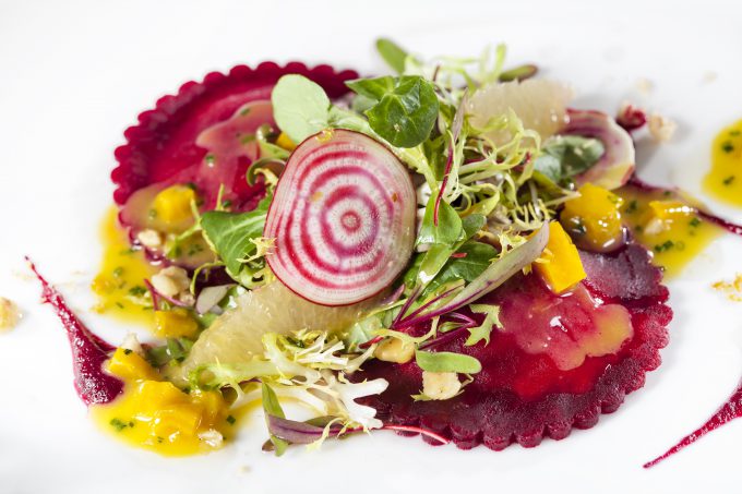 Pops of color come from vegetables in the scarlet beet ravioli.