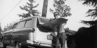 Dick Metz with a Matt Kevlin-shaped balsa surfboard_Surfing Heritage and Culture Center/Dick Metz Collection/shacc.org